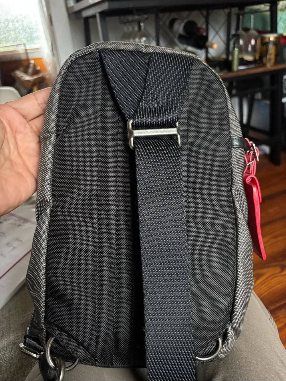 Tumi FIFE Gray SLIM Sling Bag dark grey and black.
